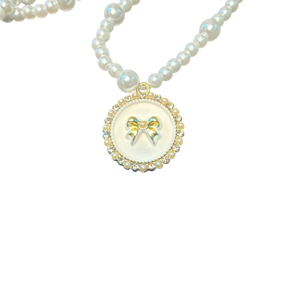 Elegant Pearl Necklace with Gold Bow Pendant